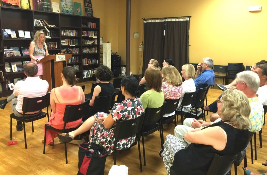 Katie reading to a full room