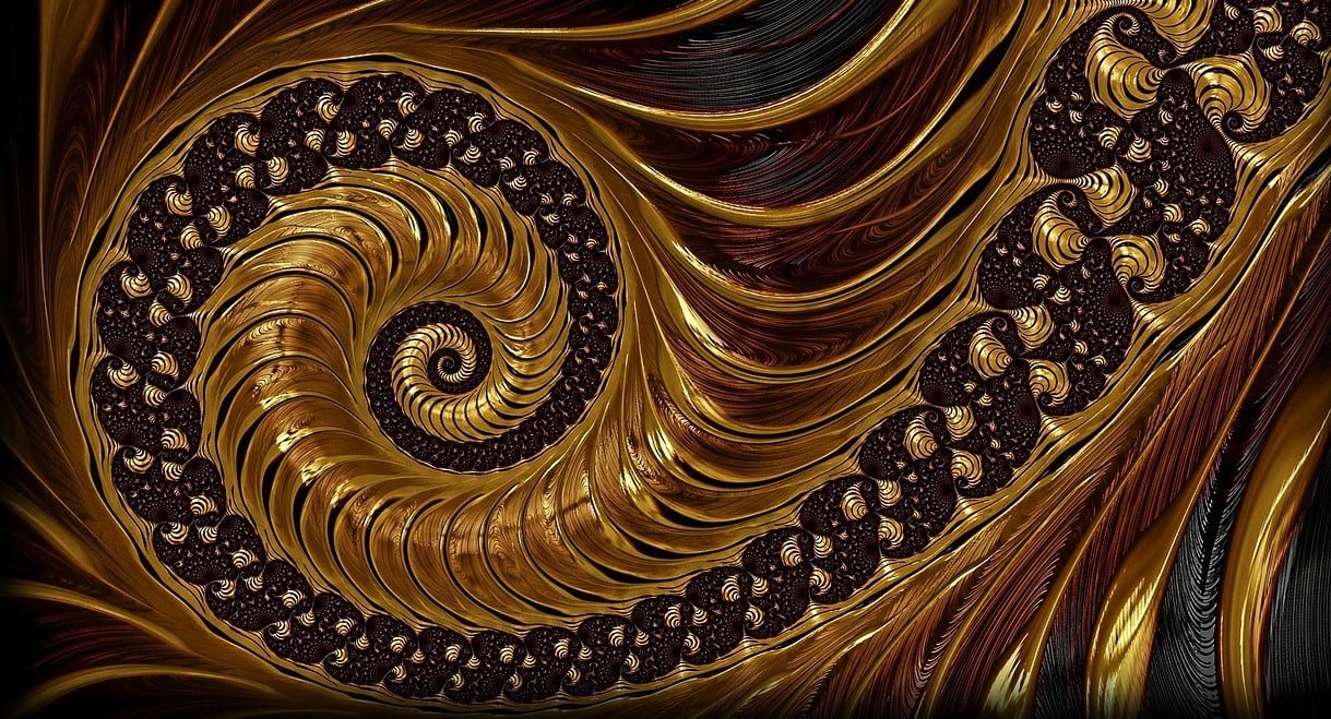 Alt text: a photographic image of a fractal in brown and gold tones, spiraling counter-clockwise. Image via Pixabay.